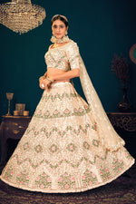Load image into Gallery viewer, Georgette Attractive Embroidered Wedding Wear Lehenga Choli In Beige Color
