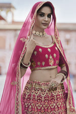 Load image into Gallery viewer, Designer Embroidered Wedding Wear Lehenga Choli In Pink Color Velvet Fabric
