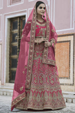 Load image into Gallery viewer, Heavy Embroidered Wedding Wear Lehenga Choli In Pink Color Velvet Fabric
