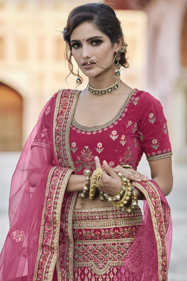 Pink Heavy Embroidered Wedding Wear Lehenga Choli In Velvet Fabric