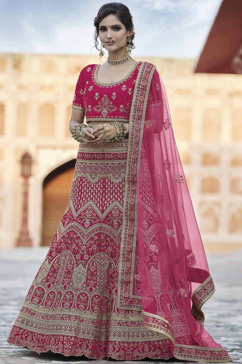 Pink Heavy Embroidered Wedding Wear Lehenga Choli In Velvet Fabric