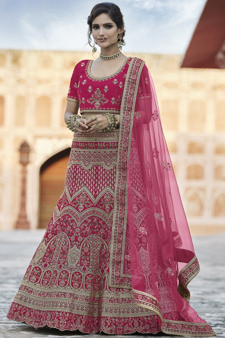Pink Heavy Embroidered Wedding Wear Lehenga Choli In Velvet Fabric