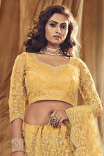 Load image into Gallery viewer, Embroidered Stylish Lehenga Choli In Yellow Color Net Fabric
