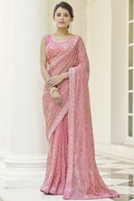 Load image into Gallery viewer, Tempting Georgette Fabric Pink Color Party Wear Saree With Embroidered Work