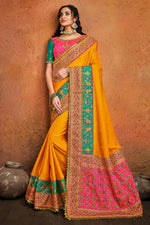 Load image into Gallery viewer, Fancy Satin Fabric Puja Wear Mustard Color Embroidery Work Saree
