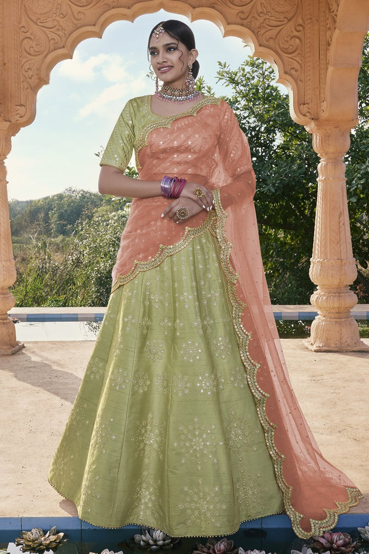 Silk Fabric Sangeet Wear Embroidered Lehenga Choli In Green Color