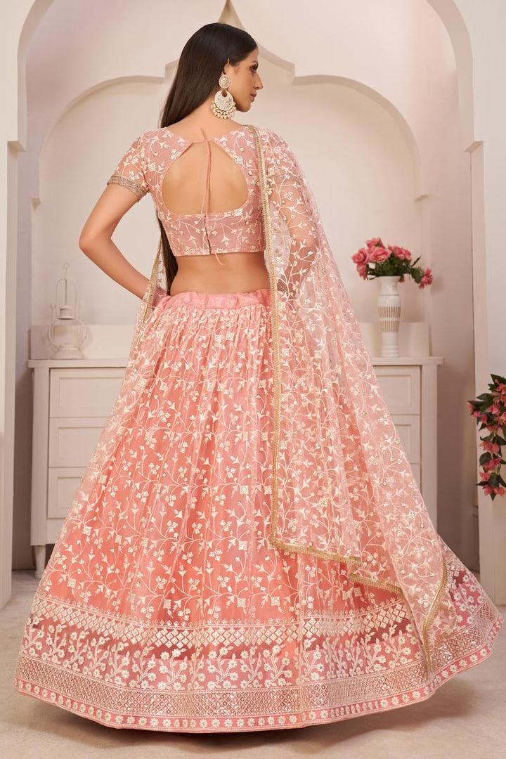 Pink Color Sangeet Wear Lehenga Choli With Wonderful Embroidered Work In Net Fabric