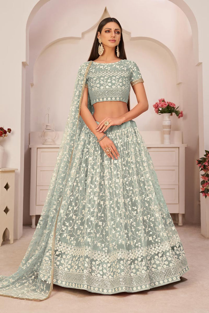 Sangeet Wear Sea Green Color Lehenga Choli With Dazzling Embroidered Work In Net Fabric