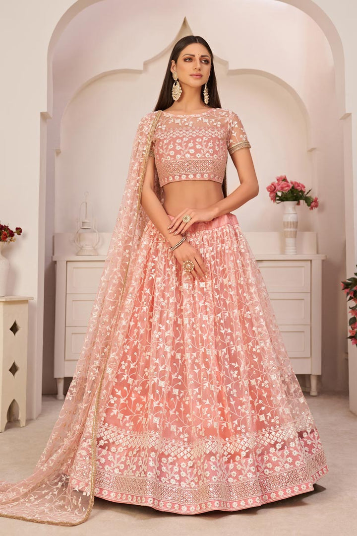 Pink Color Sangeet Wear Lehenga Choli With Wonderful Embroidered Work In Net Fabric