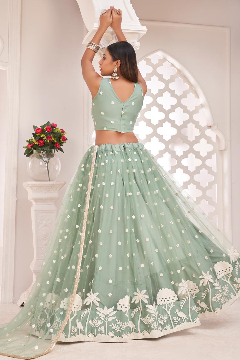 Sea Green Color Sangeet Wear Net Fabric Flamboyant Embroidered Lehenga