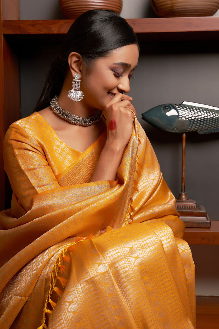 Weaving Work On Glamorous Saree In Yellow Kanjivaram Silk