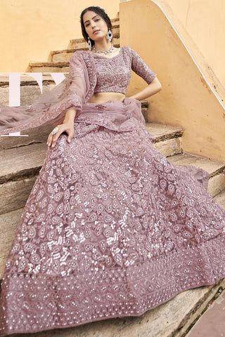 Net Fabric Ravishing Embroidered Lehenga In Peach Color