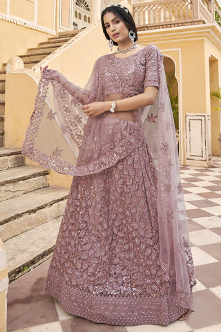 Net Fabric Ravishing Embroidered Lehenga In Peach Color