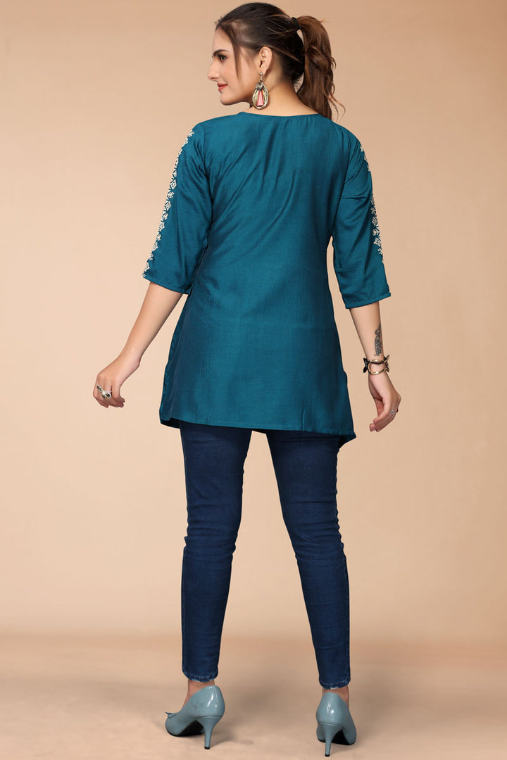 Rayon Fabric Teal Color Short Kurti With Fascinating Embroidered Work