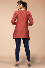 Load image into Gallery viewer, Creative Embroidered Work On Rayon Fabric Short Kurti In Rust Color
