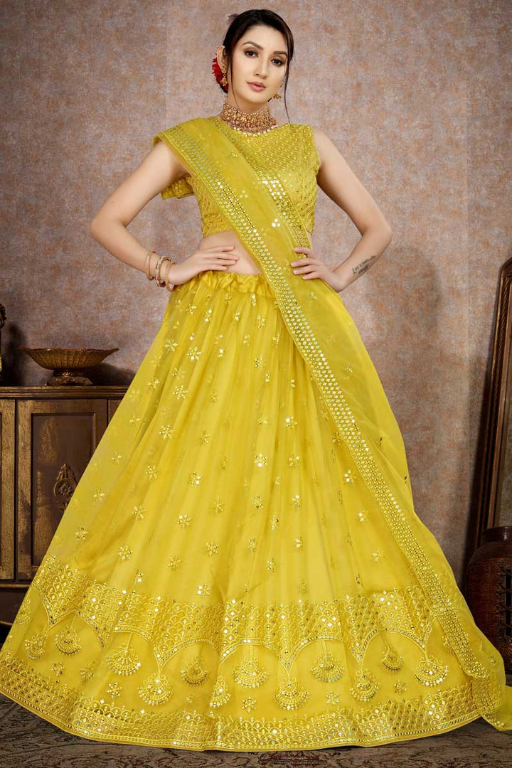 Net Fabric Brilliant Sequins Work Lehenga In Yellow Color