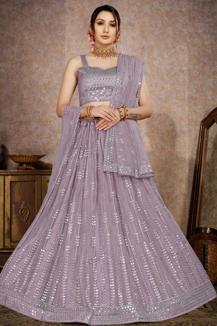 Net Fabric Stunning Sequins Work Lehenga In Lavender Color