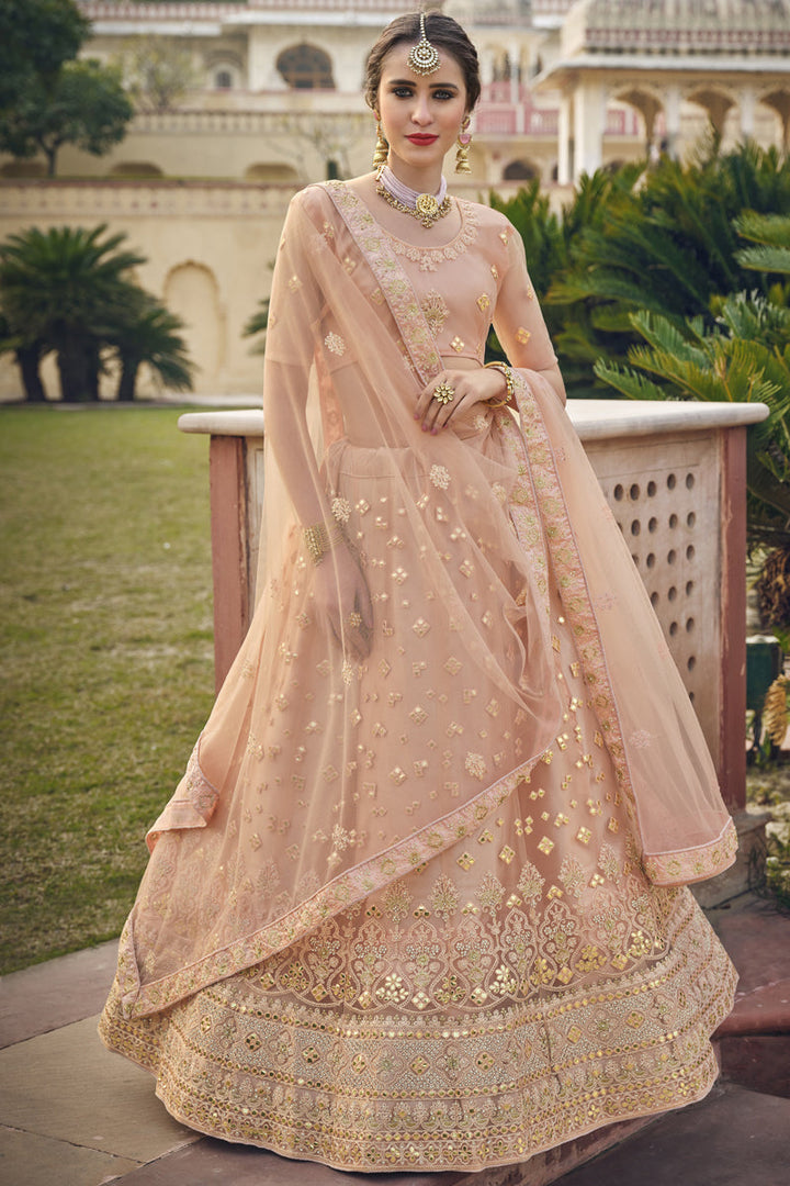 Net Fabric Designer Wedding Lehenga Choli In Peach Color