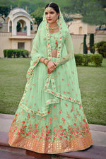Load image into Gallery viewer, Sea Green Color Sangeet Wear Lehenga With Wonderful Embroidered Work In Net Fabric
