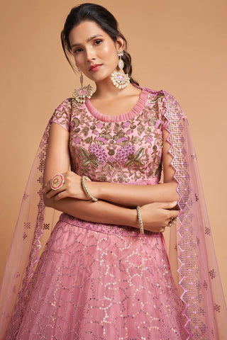 Sangeet Wear Pink Color Net Fabric Mesmeric Lehenga With Embroidered Work