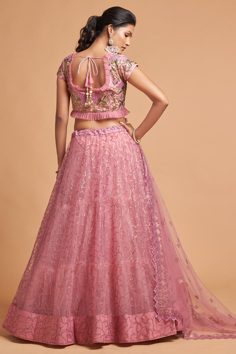 Sangeet Wear Pink Color Net Fabric Mesmeric Lehenga With Embroidered Work