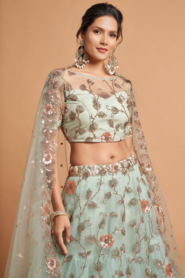 Net Fabric Sangeet Wear Sea Green Color Provocative Lehenga With Embroidered Work