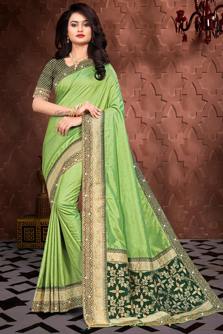Party Wear Art Silk Fabric Fancy Border Work Saree In Green Color