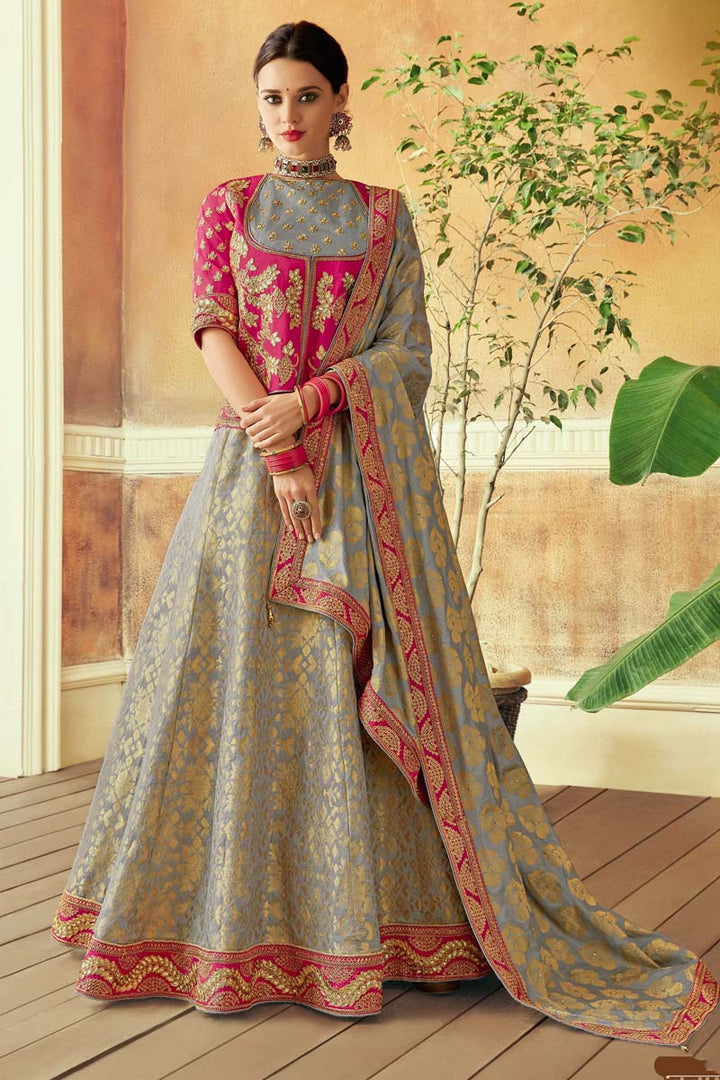 Patterned Embroidered Work On Grey Color Brocade Fabric Wedding Wear Lehenga