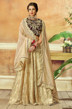 Load image into Gallery viewer, Net Fabric Beige Color Wedding Wear Pleasance Lehenga With Embroidered Work
