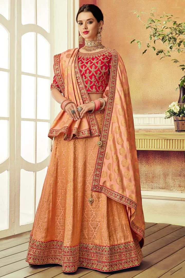 Brocade Fabric Peach Color Wedding Wear Coveted Lehenga With Embroidered Designs