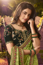 Load image into Gallery viewer, Green Color Bright Fancy Fabric Function Wear Saree With Embroidered Work
