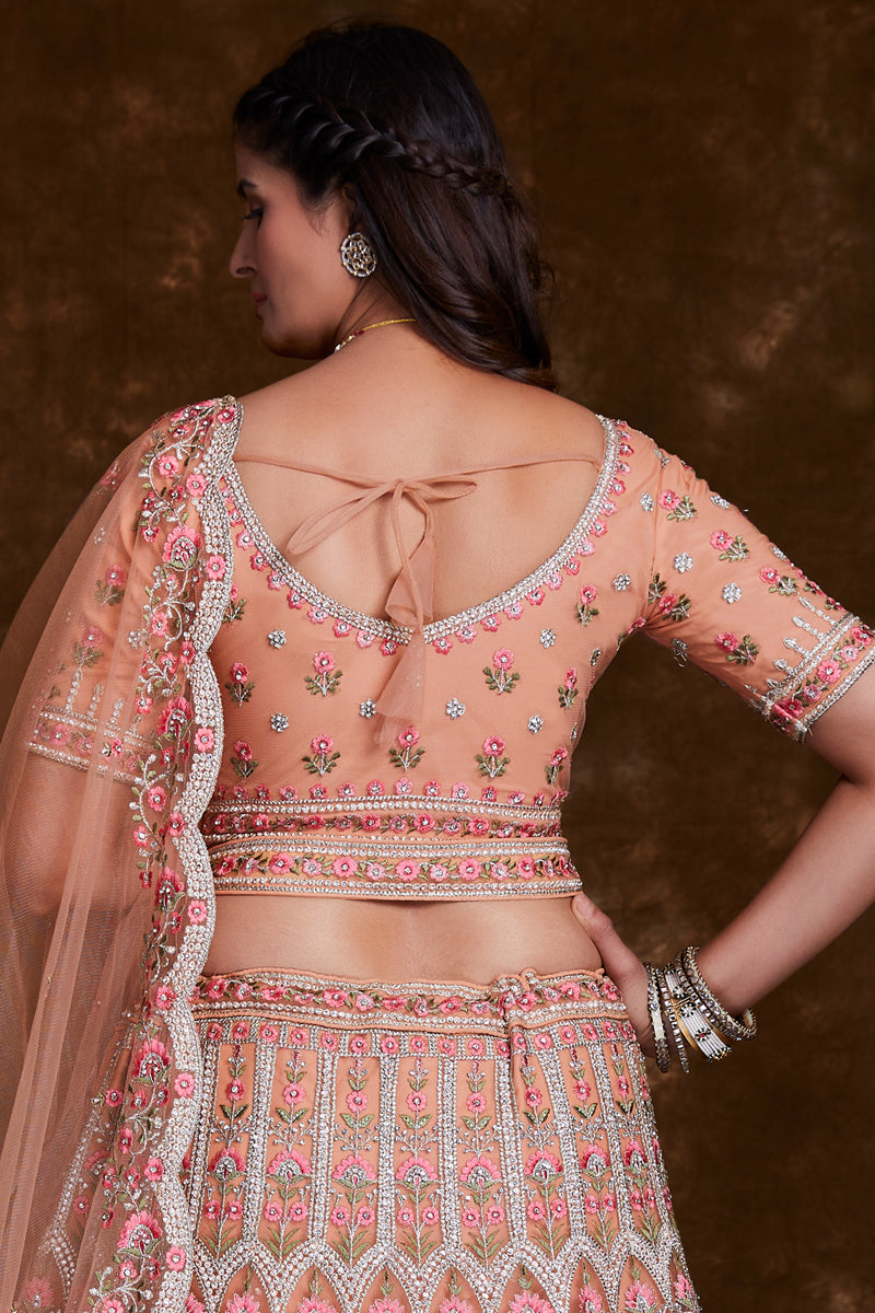 Net Wedding Wear Chaniya Choli In Peach With Embroidery Work And Designer Blouse