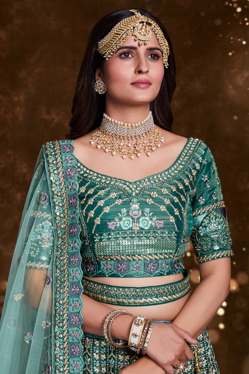 Embroidered Art Silk Wedding Wear Lehenga In Teal With Ravishing Blouse