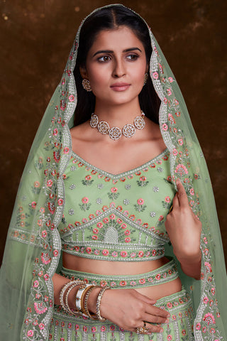 Embroidered Wedding Wear Lehenga Choli In Green Net Fabric