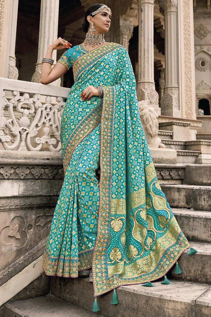 Silk Fabric Cyan Color Border Work Reception Wear Saree