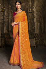 Load image into Gallery viewer, Brasso Fabric Classic Orange Color Saree With Lace Border Work
