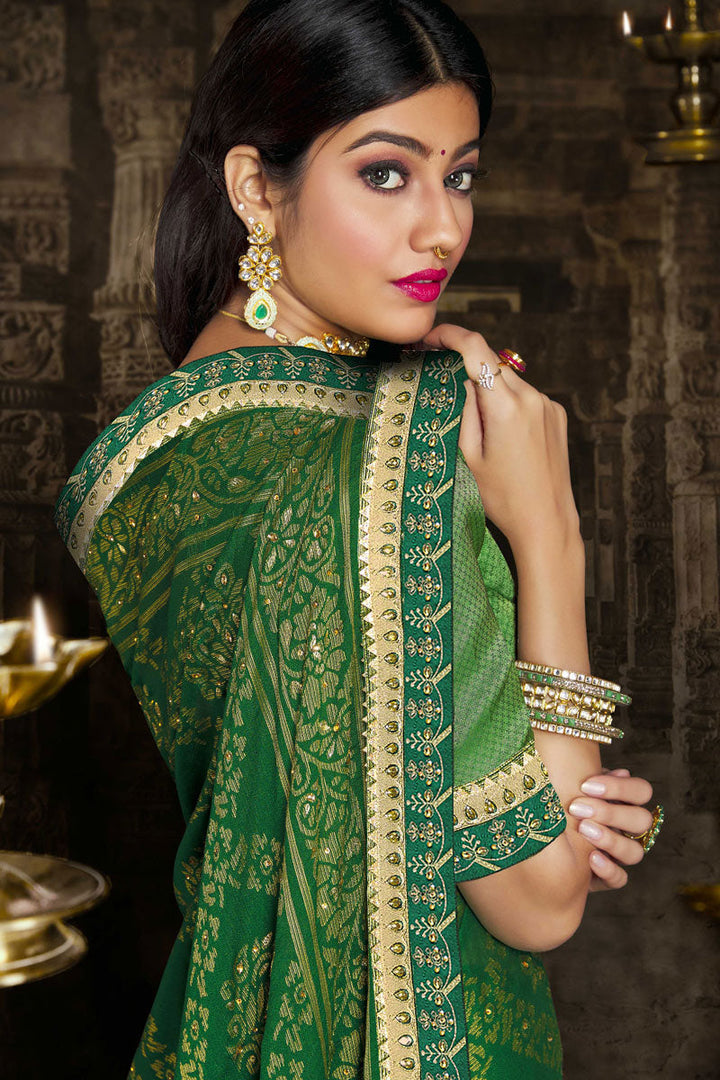 Brasso Fabric Charming Green Color Saree With Lace Border Work