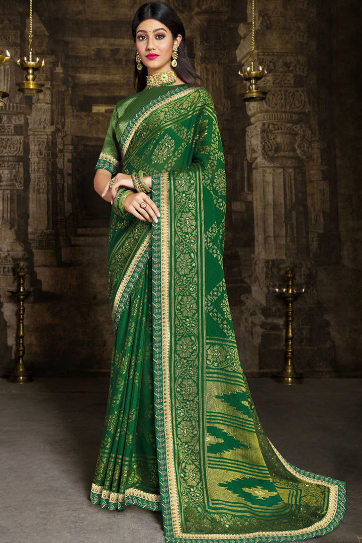 Brasso Fabric Charming Green Color Saree With Lace Border Work