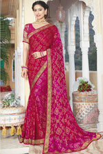 Load image into Gallery viewer, Brasso Fabric Dazzling Rani Color Sangeet Wear Saree With Lace Work
