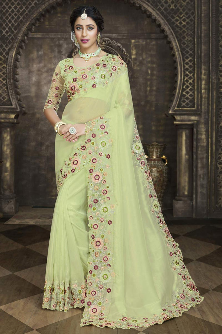 Dazzling Green Color Embroidered Border Work Saree In Tissue Fabric