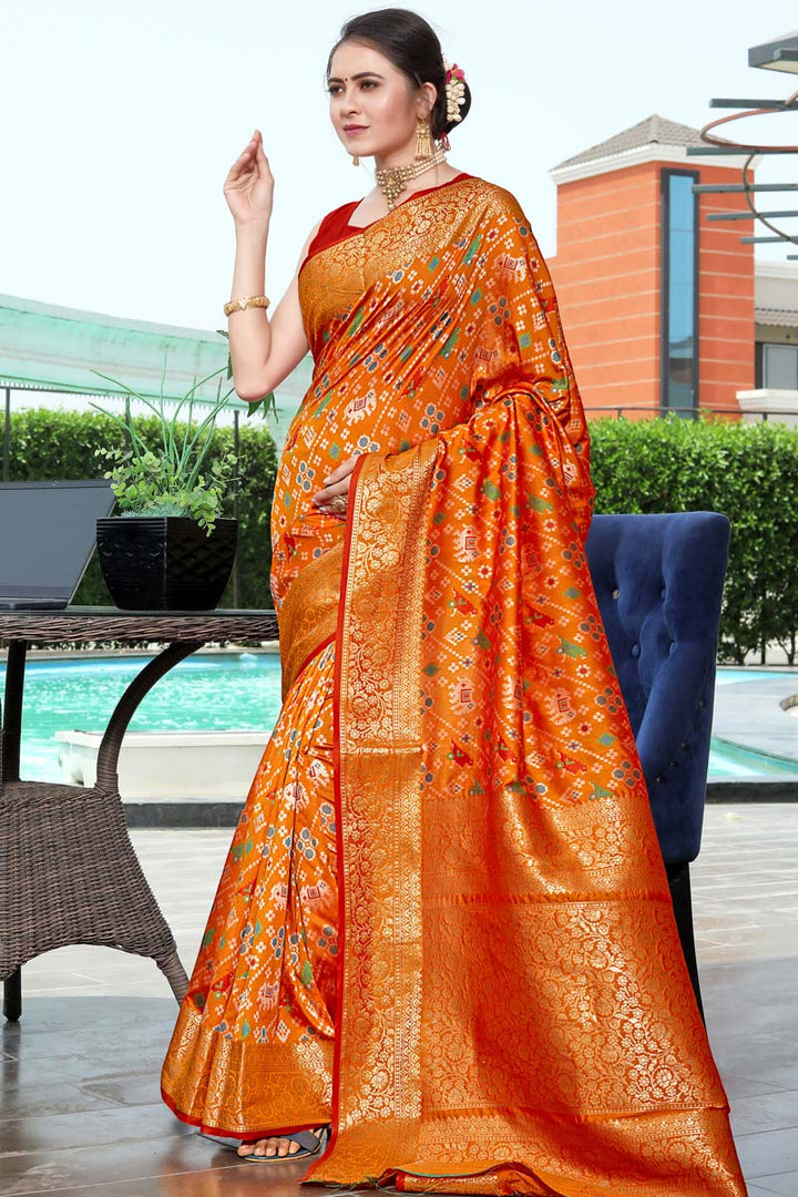 Festival Wear Banarasi Style Art Silk Fabric Orange Color Adoring Patola Print Saree