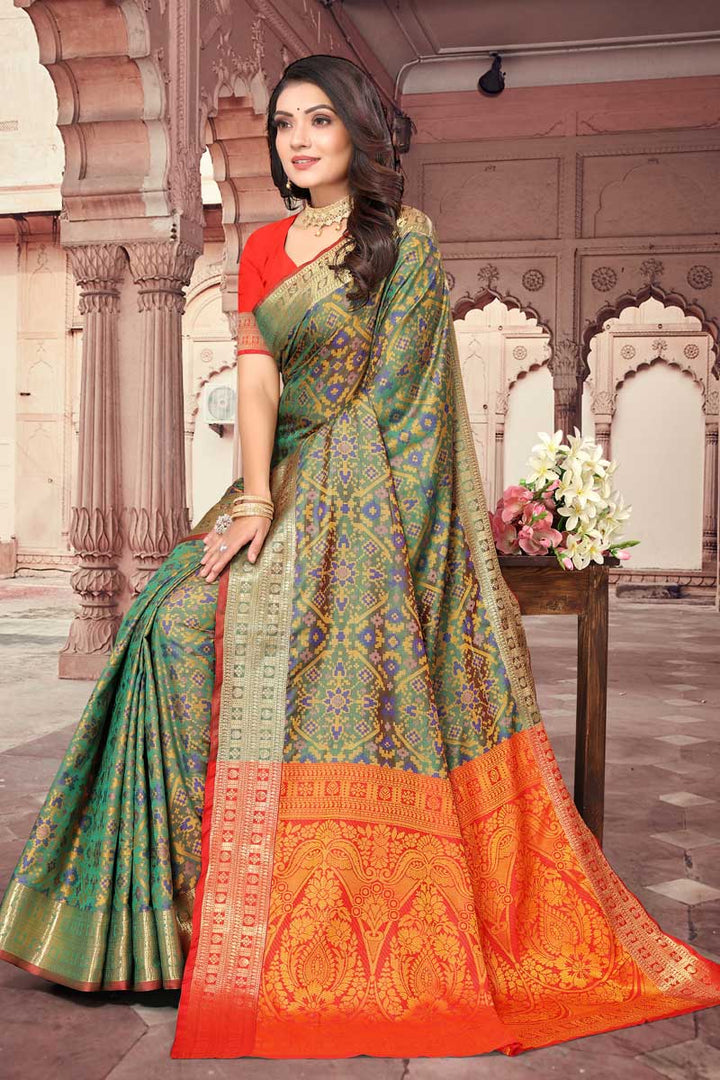 Dazzling Green Color Weaving Work Saree In Patola Silk Fabric