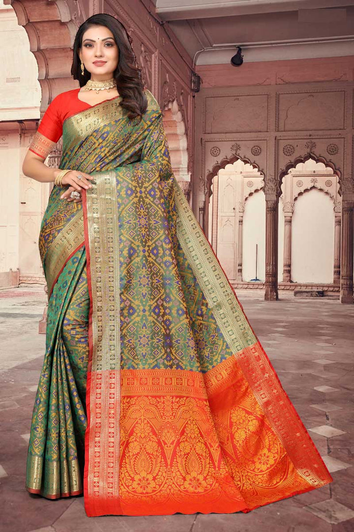 Dazzling Green Color Weaving Work Saree In Patola Silk Fabric