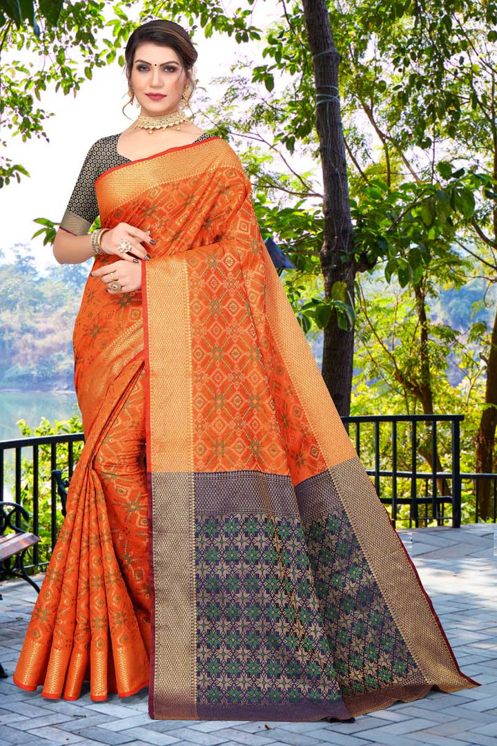 Marvelous Jacquard Work On Patola Silk Fabric Saree In Orange Color