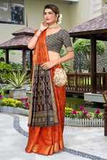 Load image into Gallery viewer, Patola Silk Fabric Rust Color Saree With Remarkable Jacquard Work

