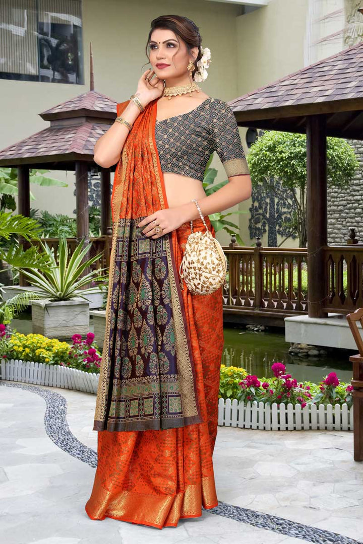 Patola Silk Fabric Rust Color Saree With Remarkable Jacquard Work