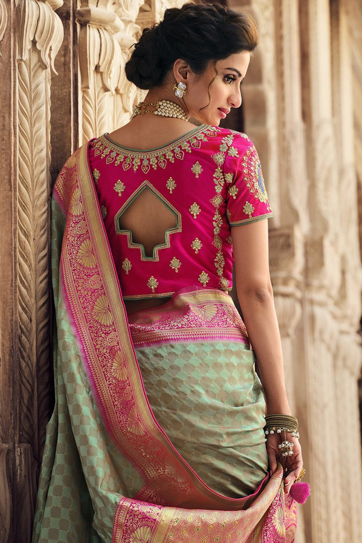 Reception Wear Silk Fabric Weaving Work Saree With Embroidered Blouse In Sea Green Color