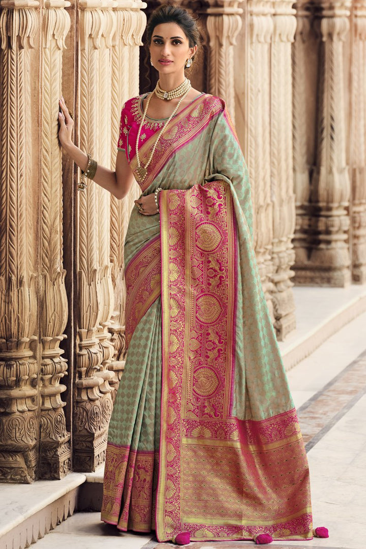 Reception Wear Silk Fabric Weaving Work Saree With Embroidered Blouse In Sea Green Color