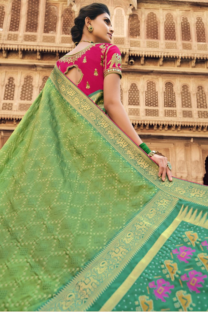 Green Color Sangeet Wear Silk Fabric Weaving Work Saree With Embroidered Blouse