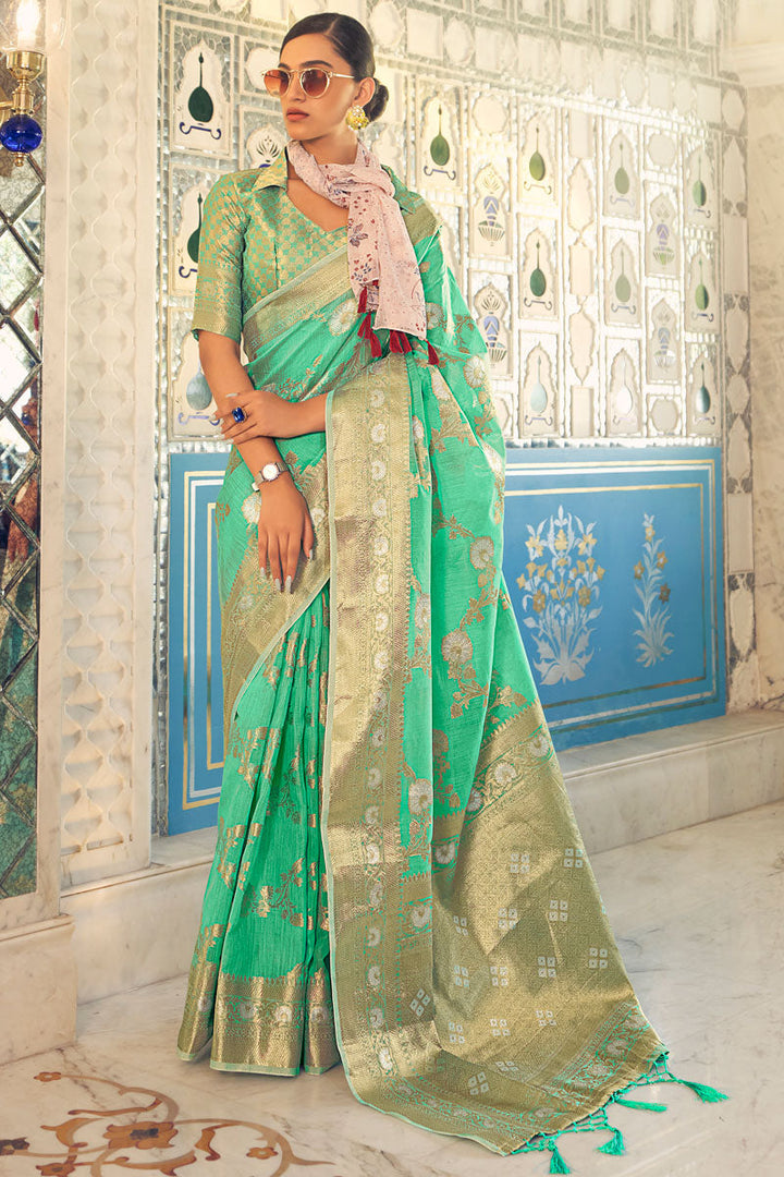 Green Color Mesmeric Weaving Work On Party Look Saree In Linen Fabric
